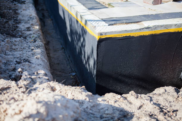 Professional Waterproofing technician working in Fowlerville, MI
